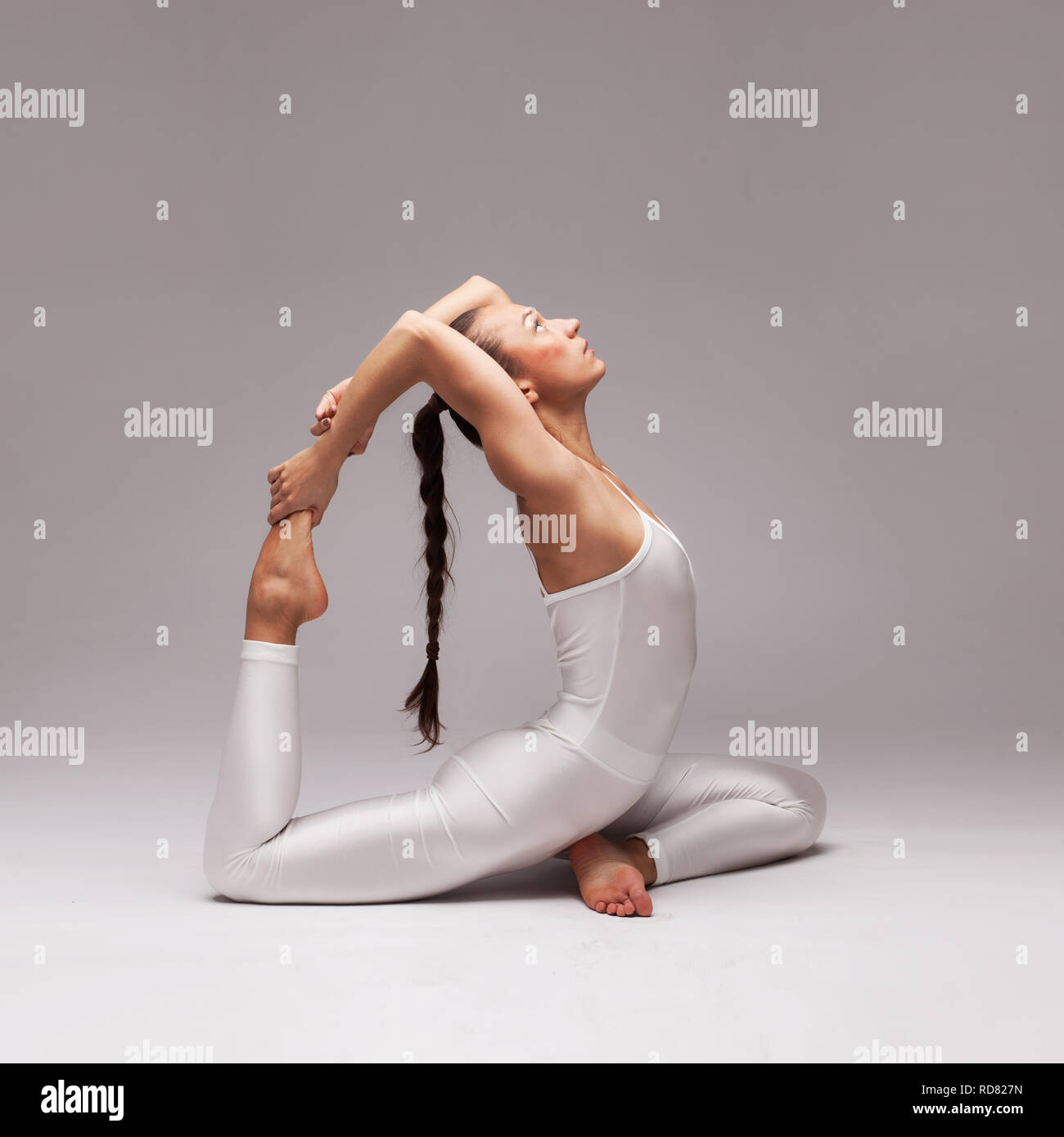 young beautiful woman yoga posing. isolated Stock Photo - Alamy