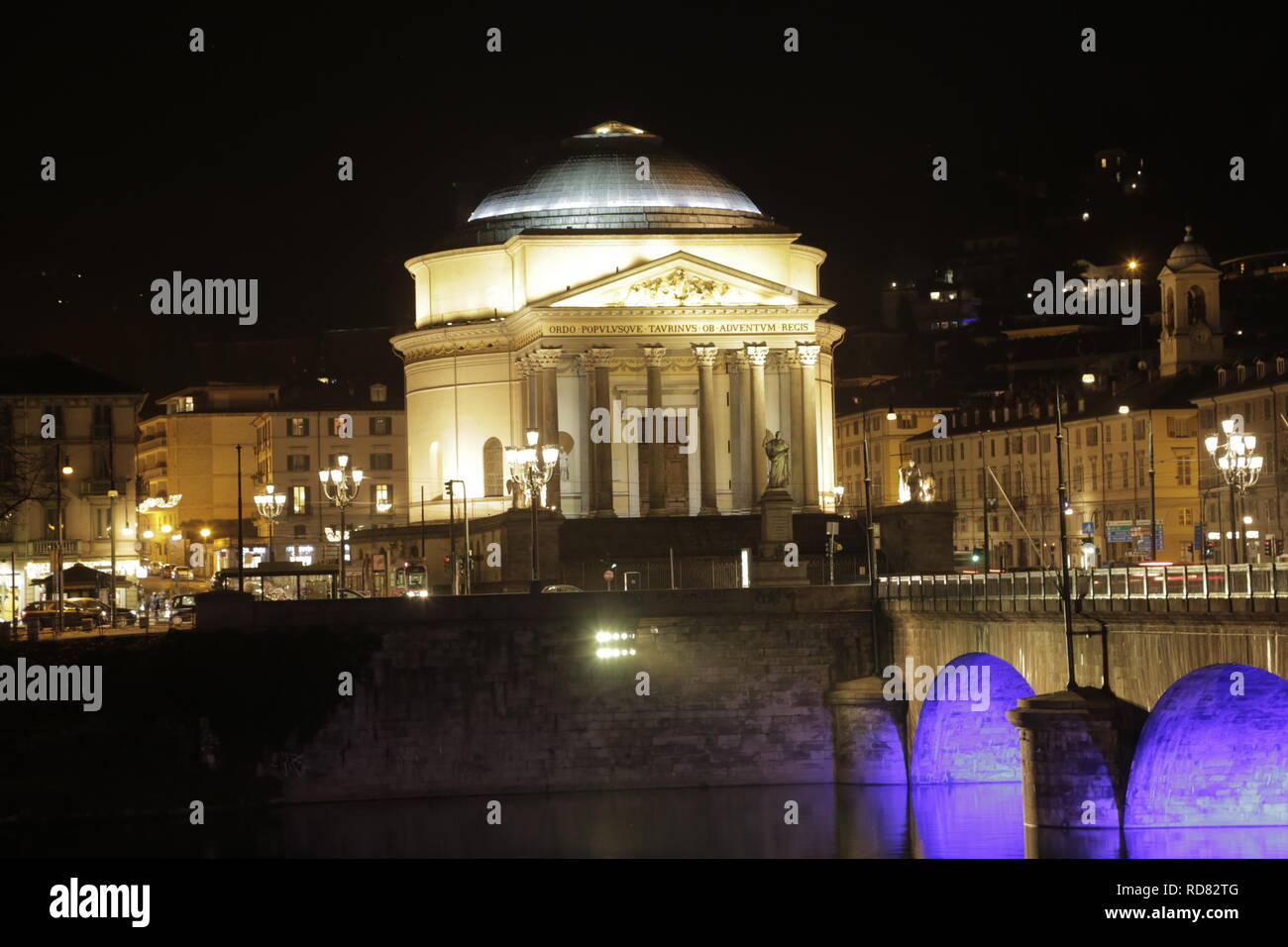 Night scene of the bridge over the po and the church of the Gran Madre. On the background, the church of Monte dei Cappuccini illuminated in blue Stock Photo