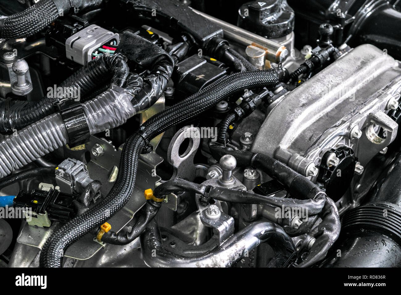 Car engine. Car engine part. Close-up image of an internal combustion engine. Engine detailing in a new car. Car detailing Stock Photo