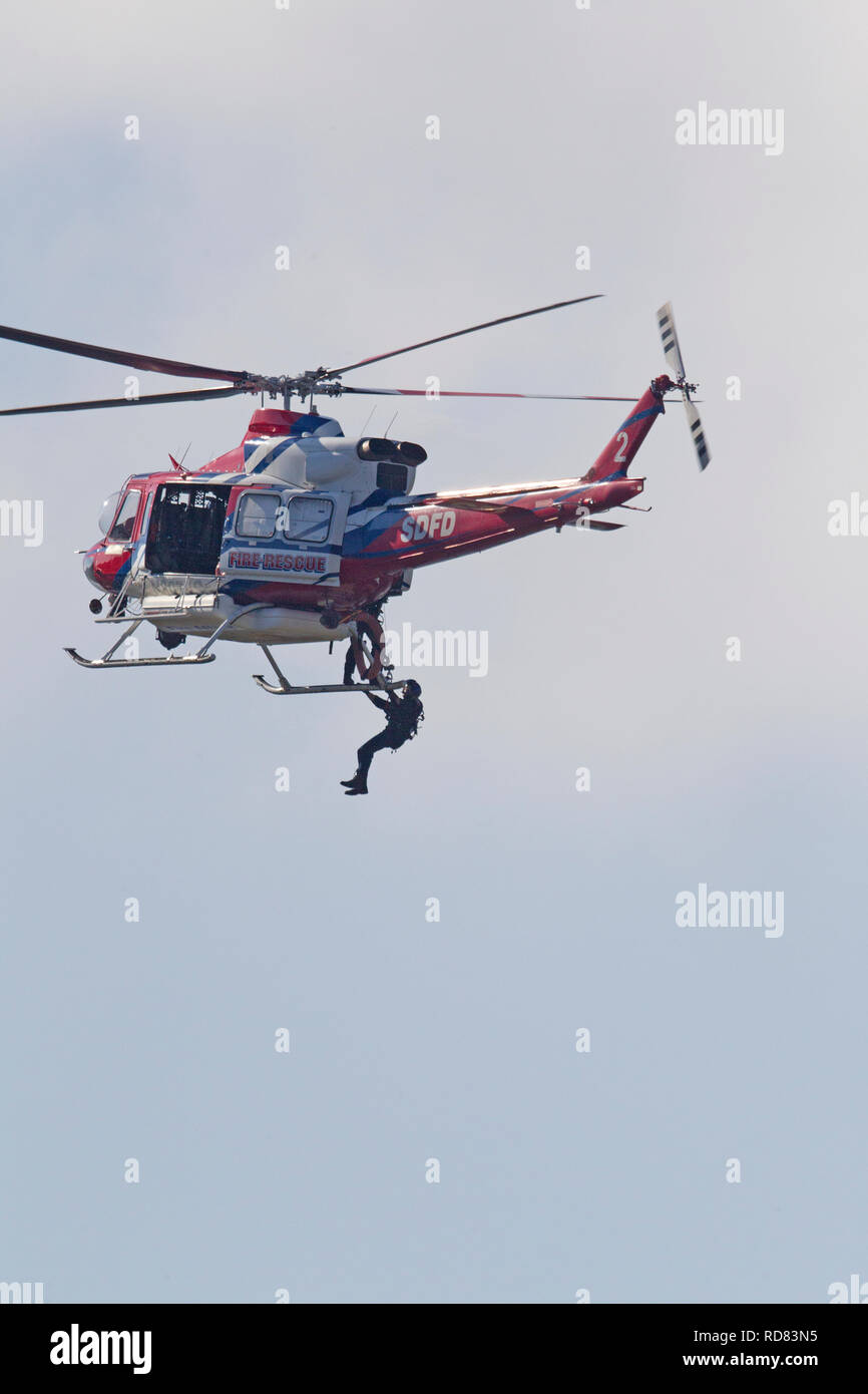 Fire Rescue Helicopter in Air Stock Photo