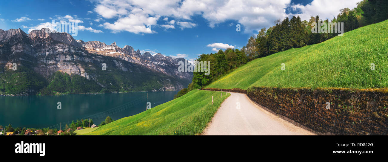 Walensee Spring Country road near Walensee lake and the Alps mountains on a sunny day ...