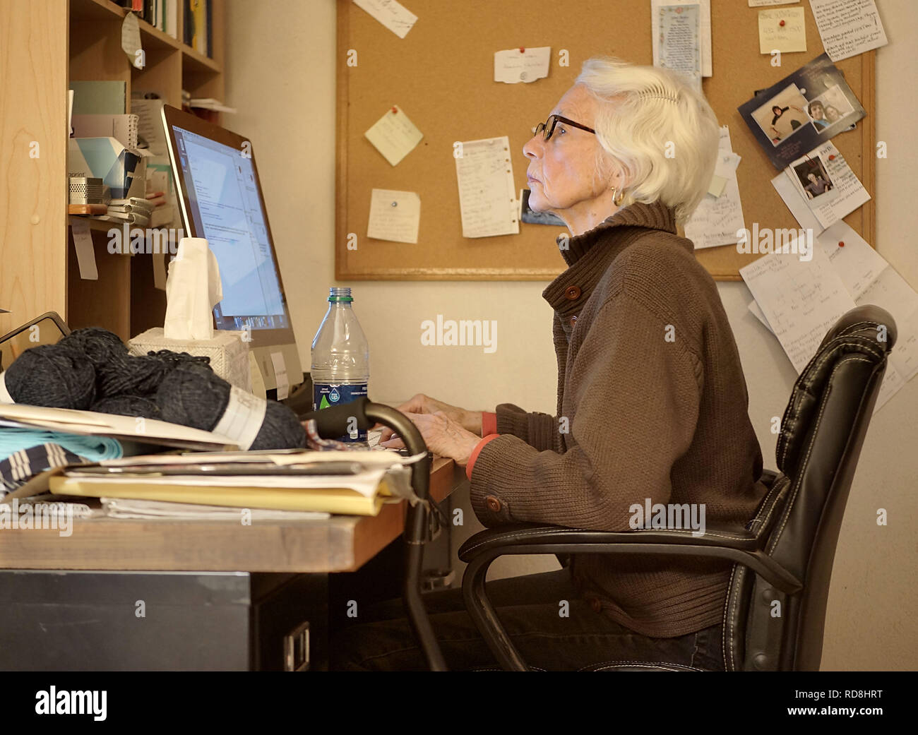 Senior woman working from home. Stock Photo