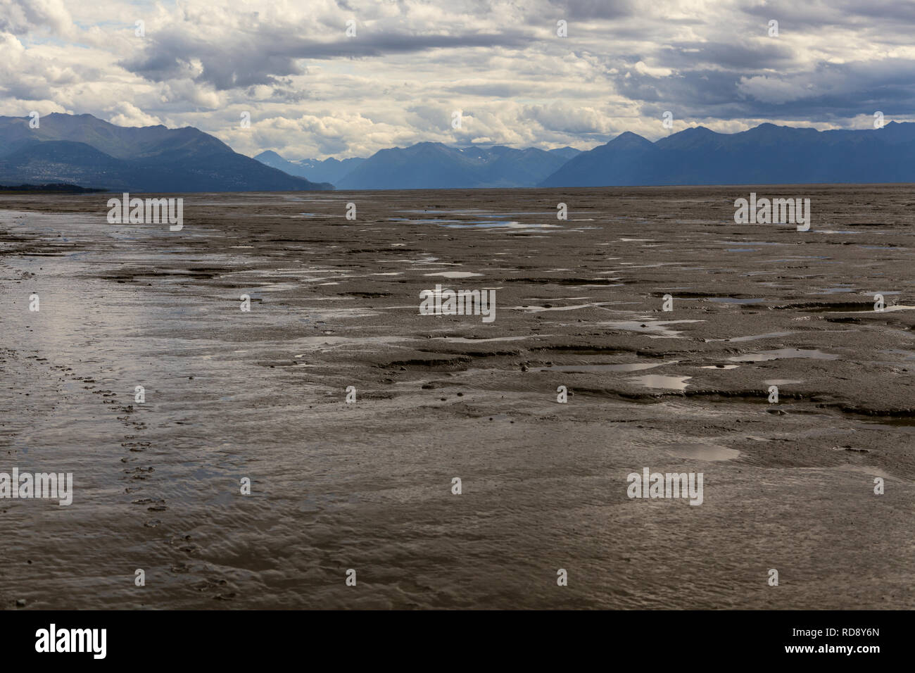 Low tide in Cook Inlet exposes miles of glacial mudflats at the Kincaid Park beach in Anchorage, Alaska Stock Photo