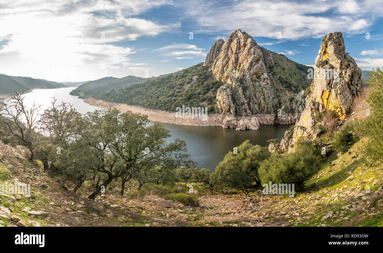 Extremadura and Tajo river crossing rugged terrain and forest creating water reflections in Salto del Gitano at the amazing Monfragüe National Park Stock Photo