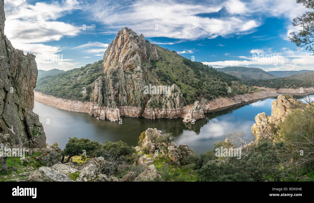 Extremadura and Tajo river crossing rugged terrain and forest creating water reflections in Salto del Gitano at the amazing Monfragüe National Park Stock Photo