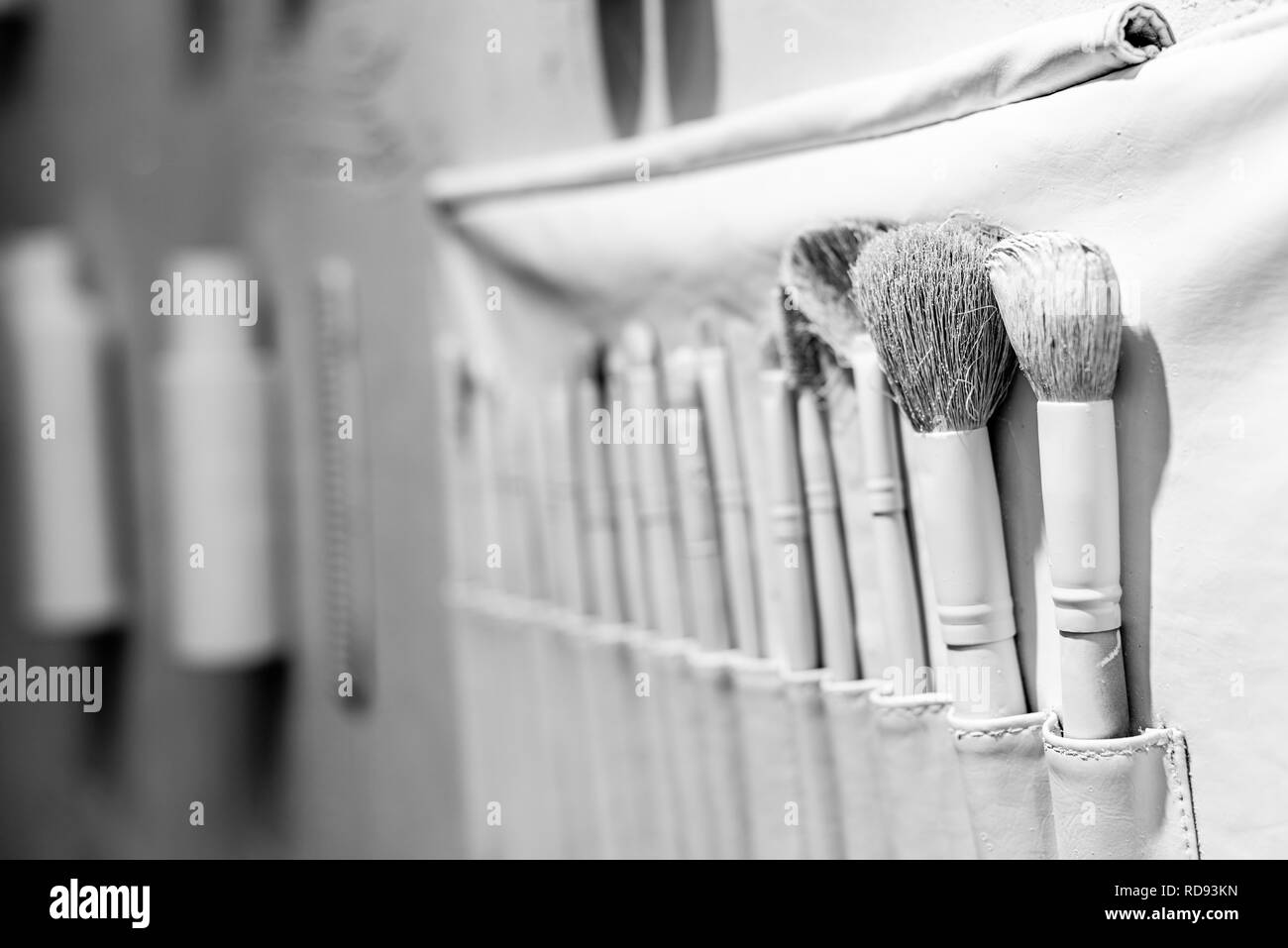 selective focus of decorative white brushes in beauty salon Stock Photo