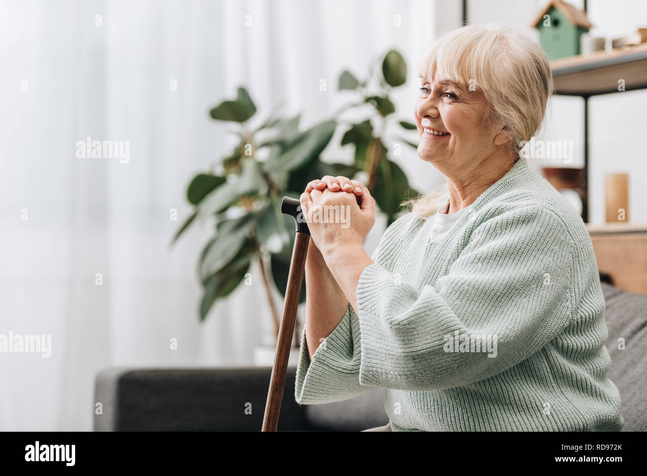 Retired woman walking stick hi-res stock photography and images - Alamy