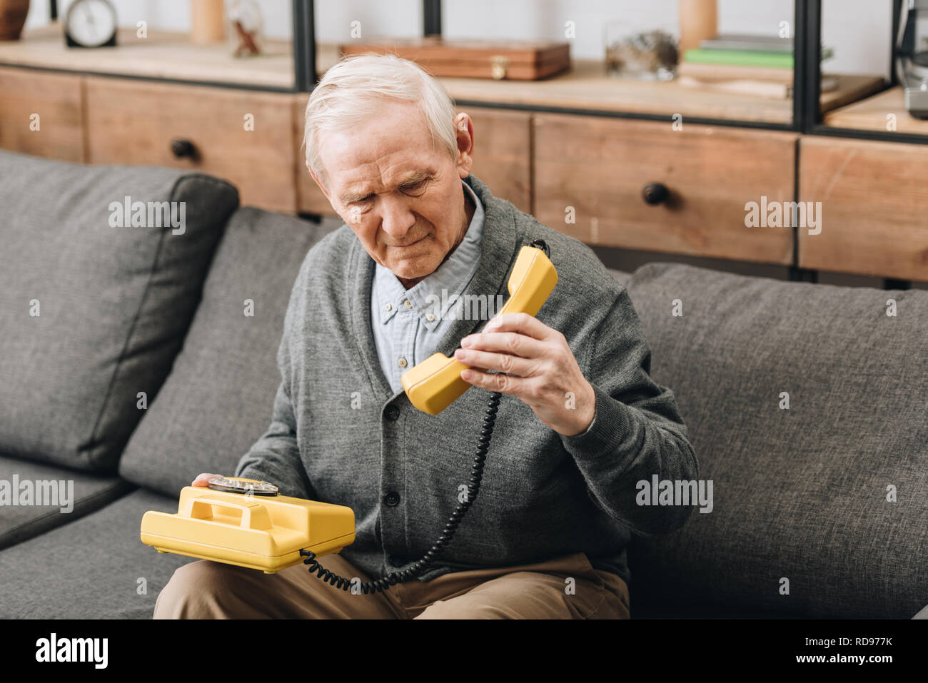 Old person on the phone and sad hi-res stock photography and images - Alamy