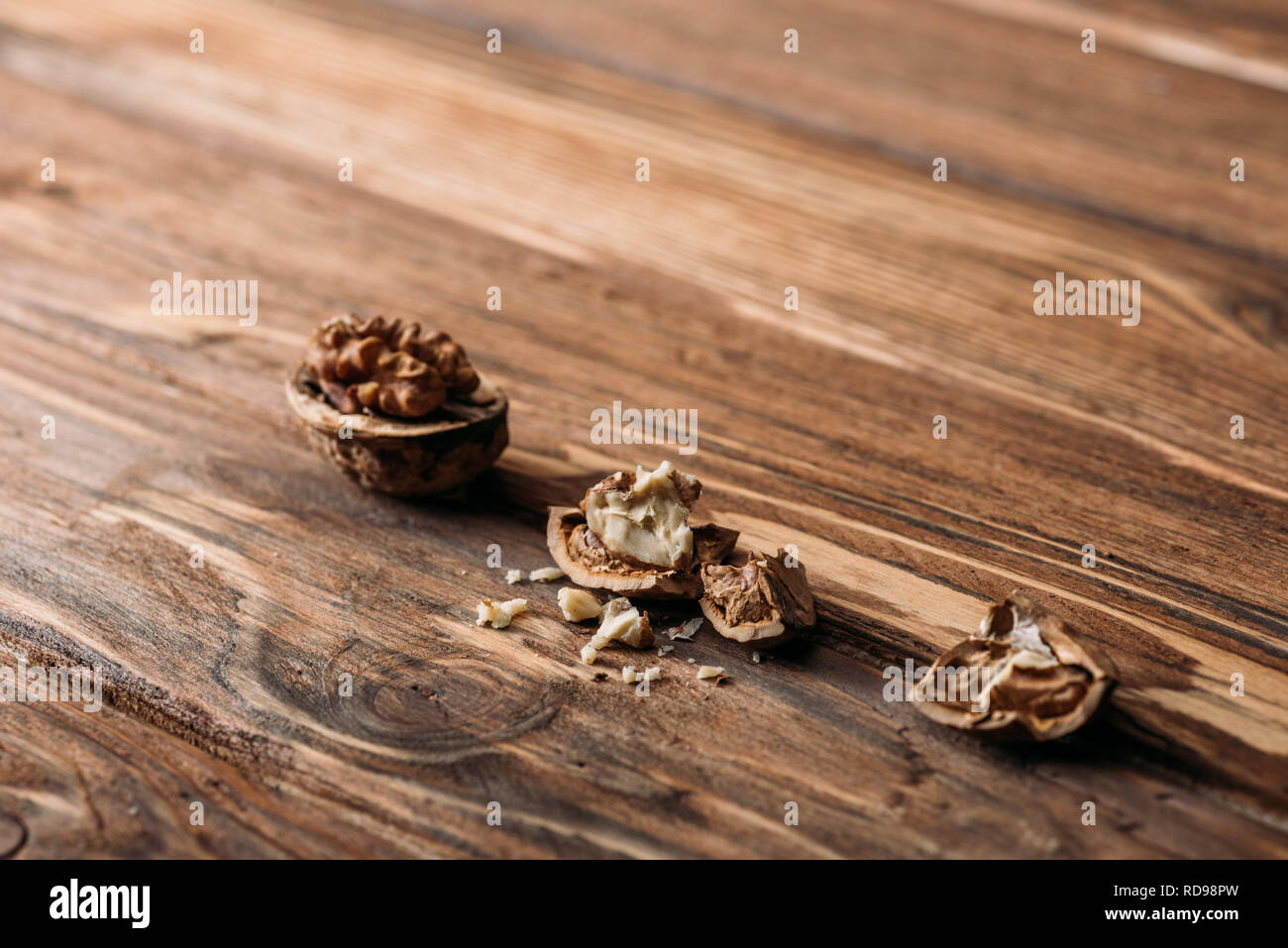 cracked walnuts as alzheimer symbol on wooden table Stock Photo Alamy