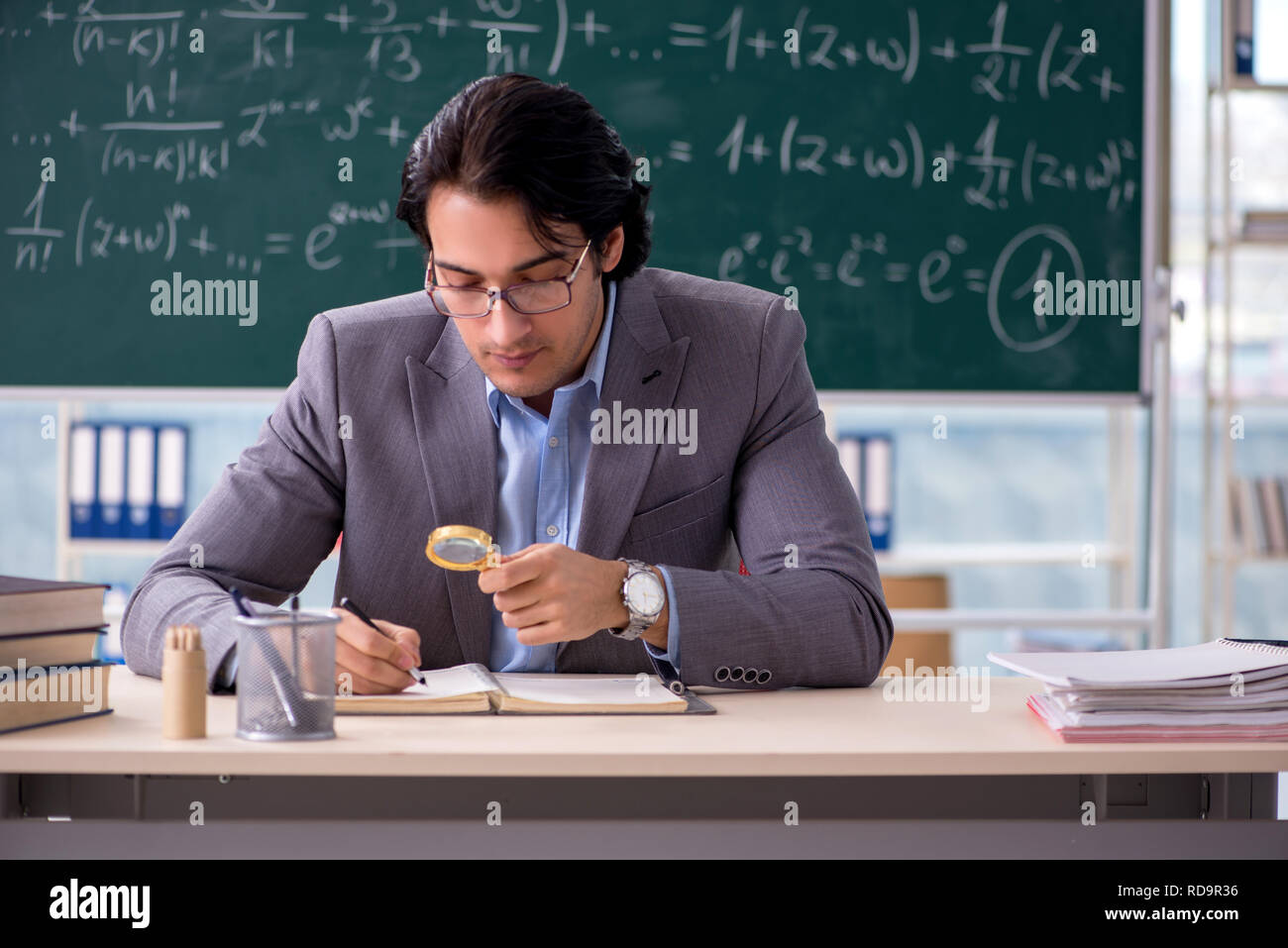 Lecturer university writing equation hi-res stock photography and ...