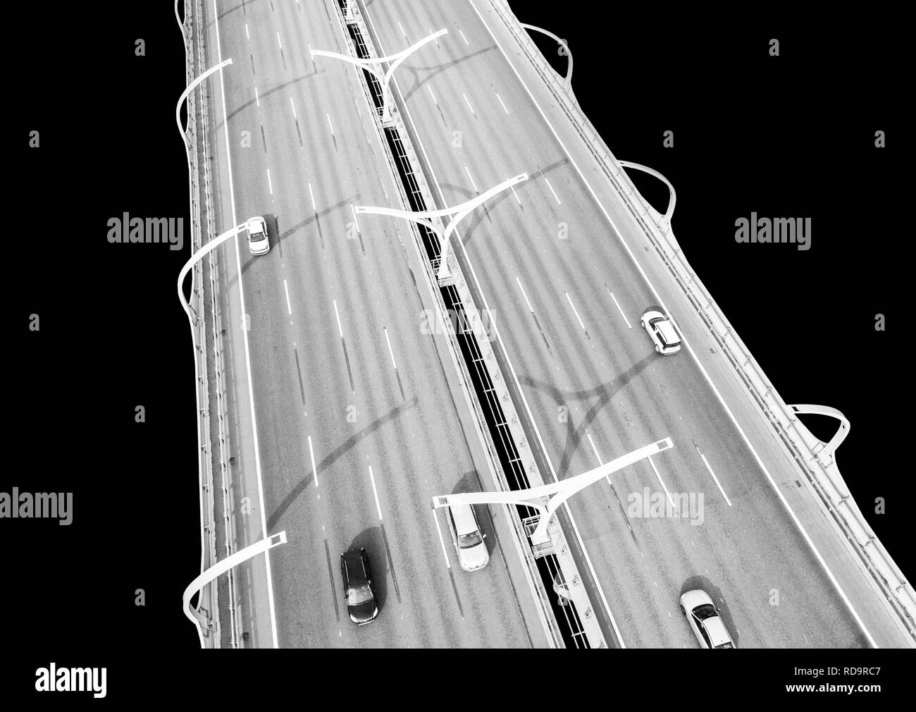 Aerial view of highway in the ocean. Cars crossing bridge interchange overpass. Highway interchange with traffic. Aerial bird's eye highway. Expresswa Stock Photo