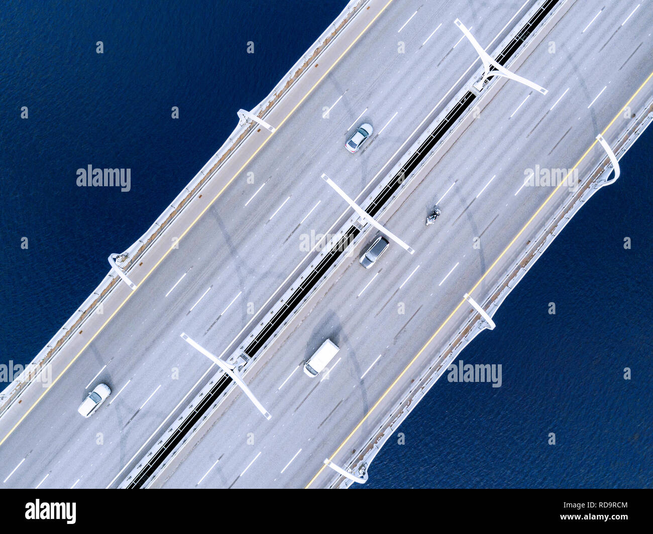 Aerial view of highway in the ocean. Cars crossing bridge interchange ...