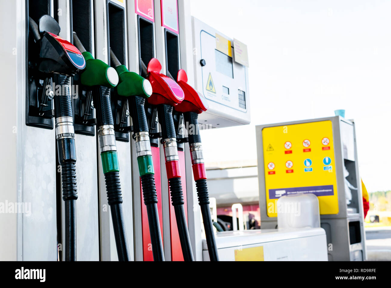 Gasoline and diesel distributor at the gas station. Gas pump nozzles