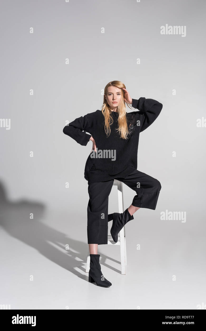 Beautiful blonde woman posing sitting hi-res stock photography and ...
