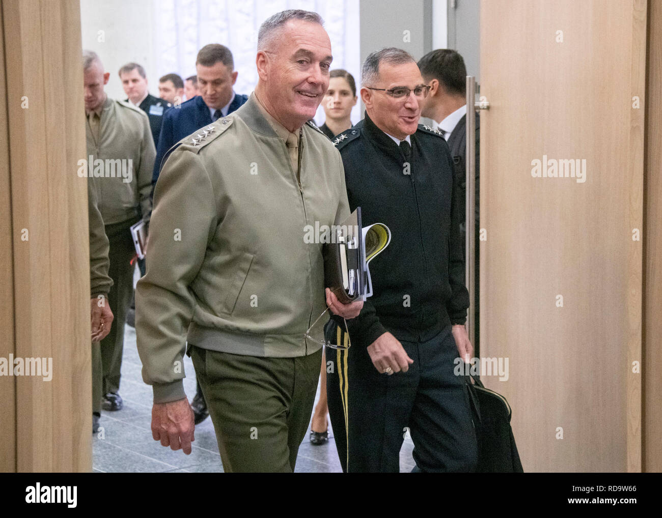 Marine Corps Gen. Joe Dunford, chairman of the Joint Chiefs of Staff, and Army Gen. Curtis M. Scapparrotti, Supreme Allied Commander Europe and commander, U.S. European Command, walk to meet with his counterpart Turkish Army Gen. Yasar Güler, Chief of the Turkish General Staff, after the 180th North Atlantic Treaty Organization Military Committee in Chiefs of Defense Session (MC/CS) at NATO headquarters in Brussels, Belgium, Jan. 16, 2019. (DOD photo by Navy Petty Officer 1st Class Dominique A. Pineiro) Stock Photo