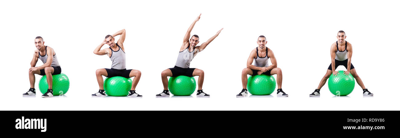 Man with swiss ball doing exercises on white Stock Photo - Alamy
