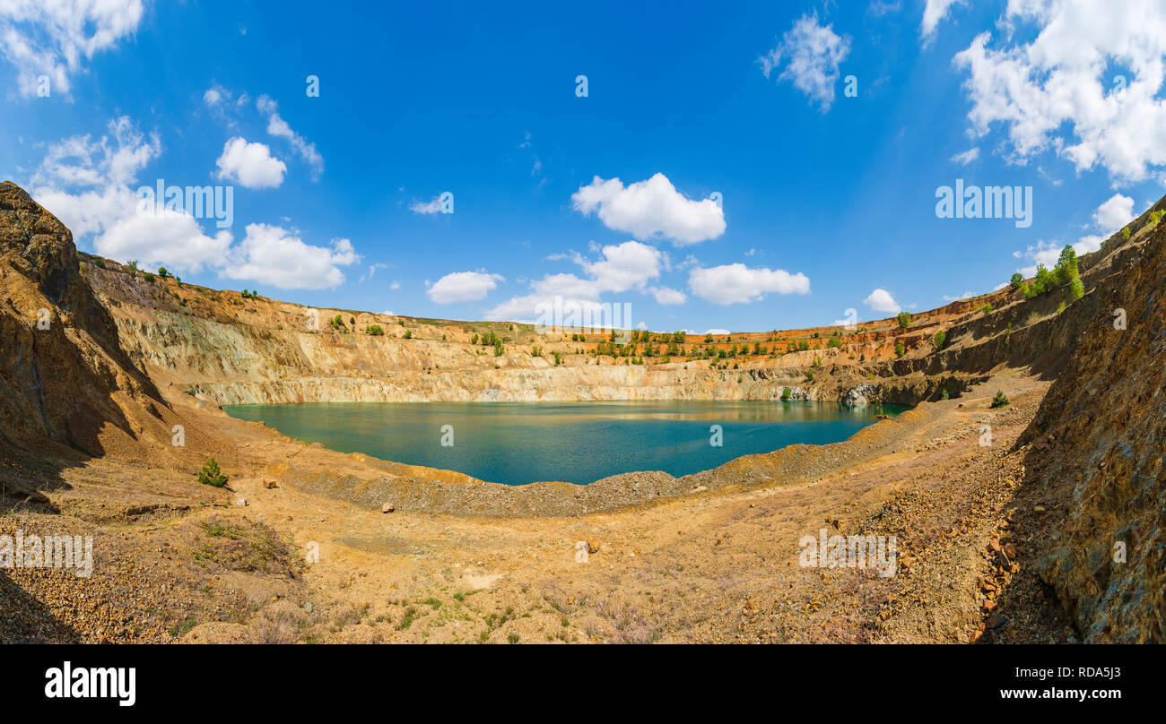 Abandoned cuprum mine in Bulgaria with lake inside Stock Photo