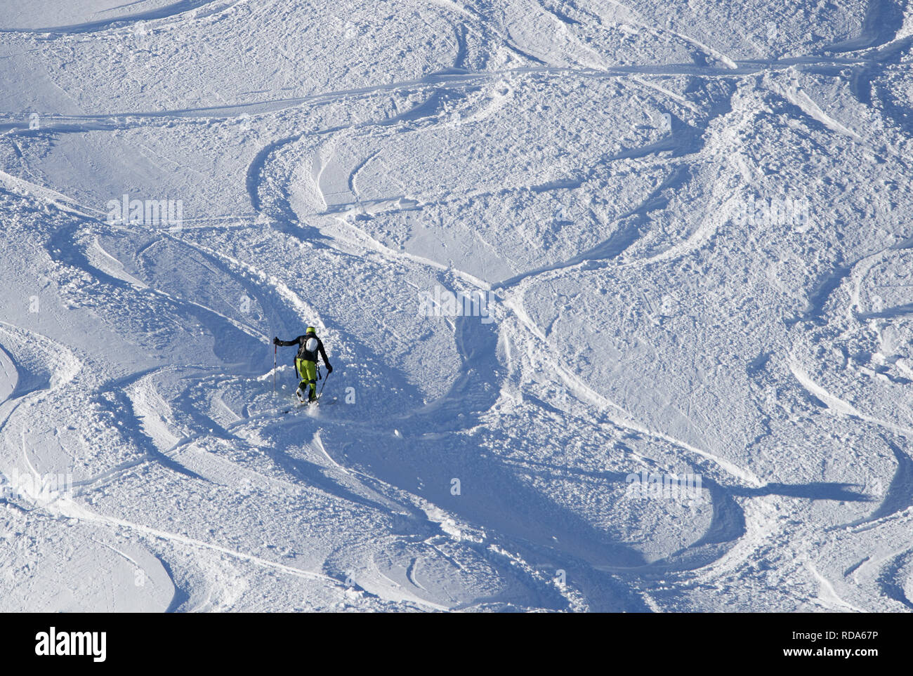 Ski tour walker ski downhill at the mountain Alpspitz in dangerous