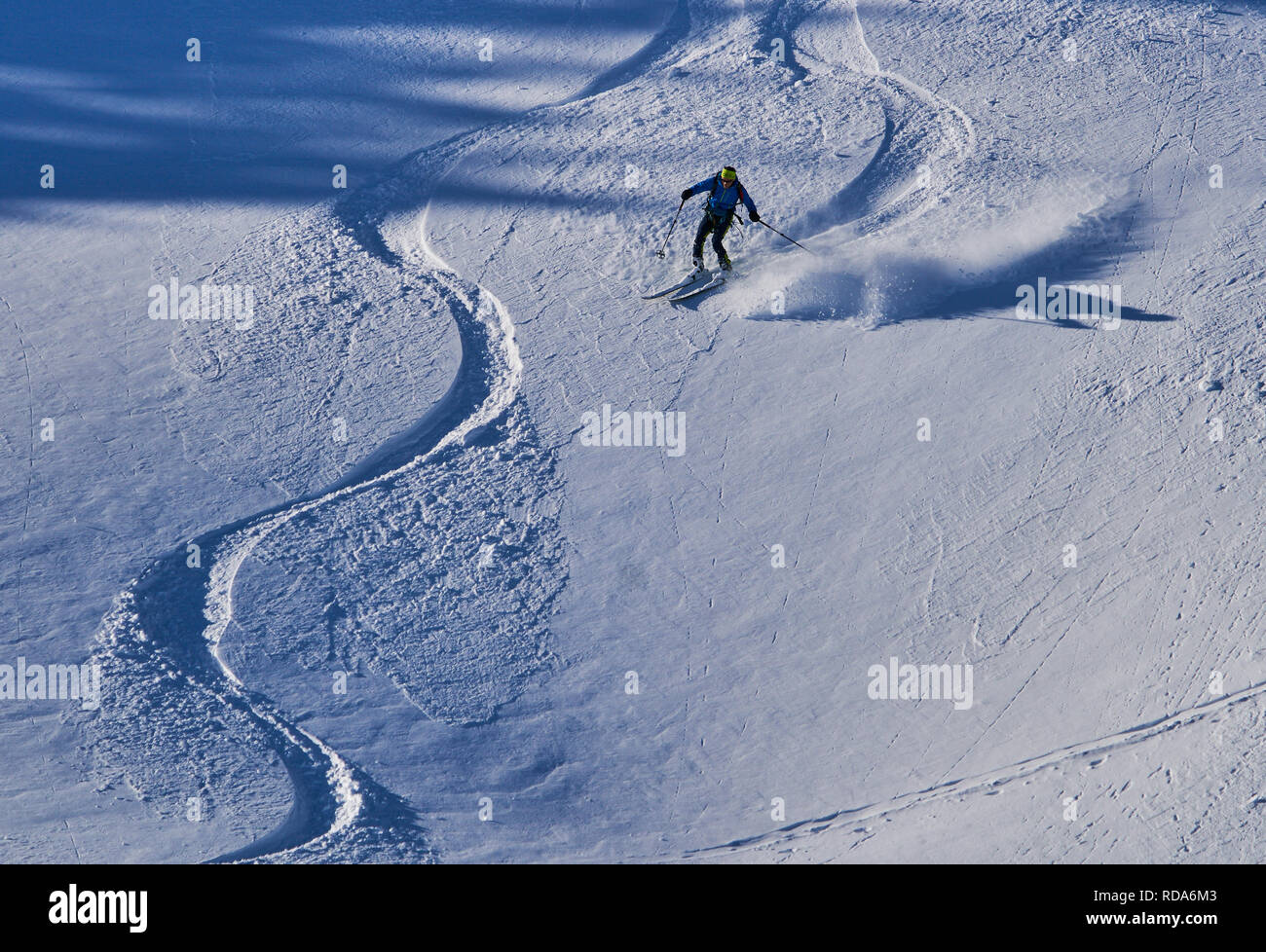 Ski tour walker ski downhill at the mountain Alpspitz in dangerous
