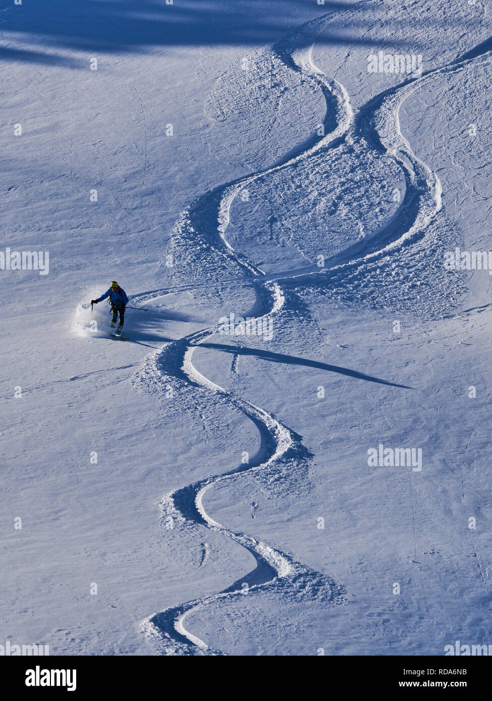 Ski tour walker ski downhill at the mountain Alpspitz in dangerous
