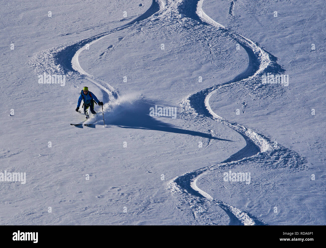 Ski tour walker ski downhill at the mountain Alpspitz in dangerous