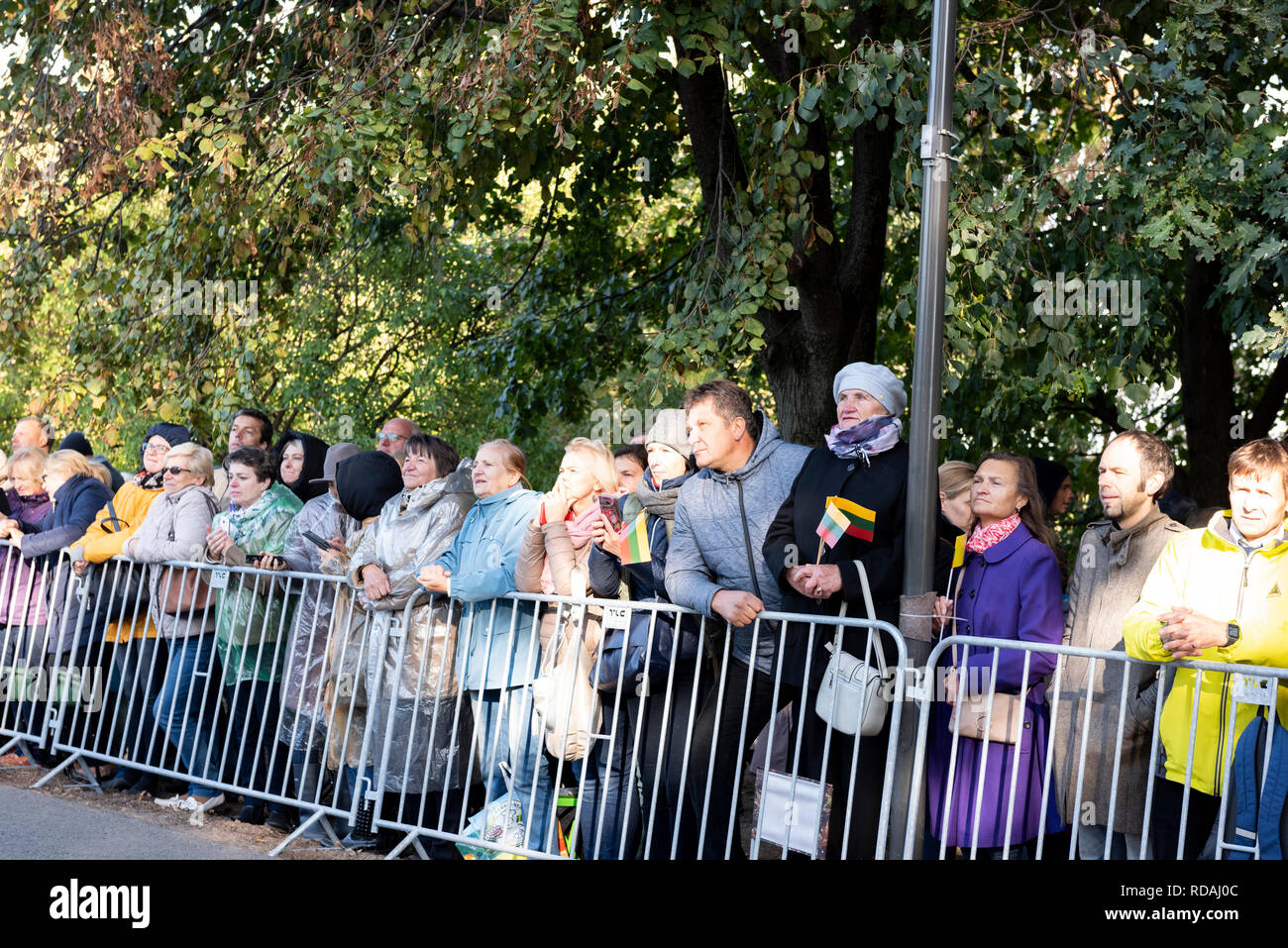 The crowd of people standing behind the fence during the Pope Francis visit to Lithuania at the Santakos Park in Kaunas, Lithuania Stock Photo