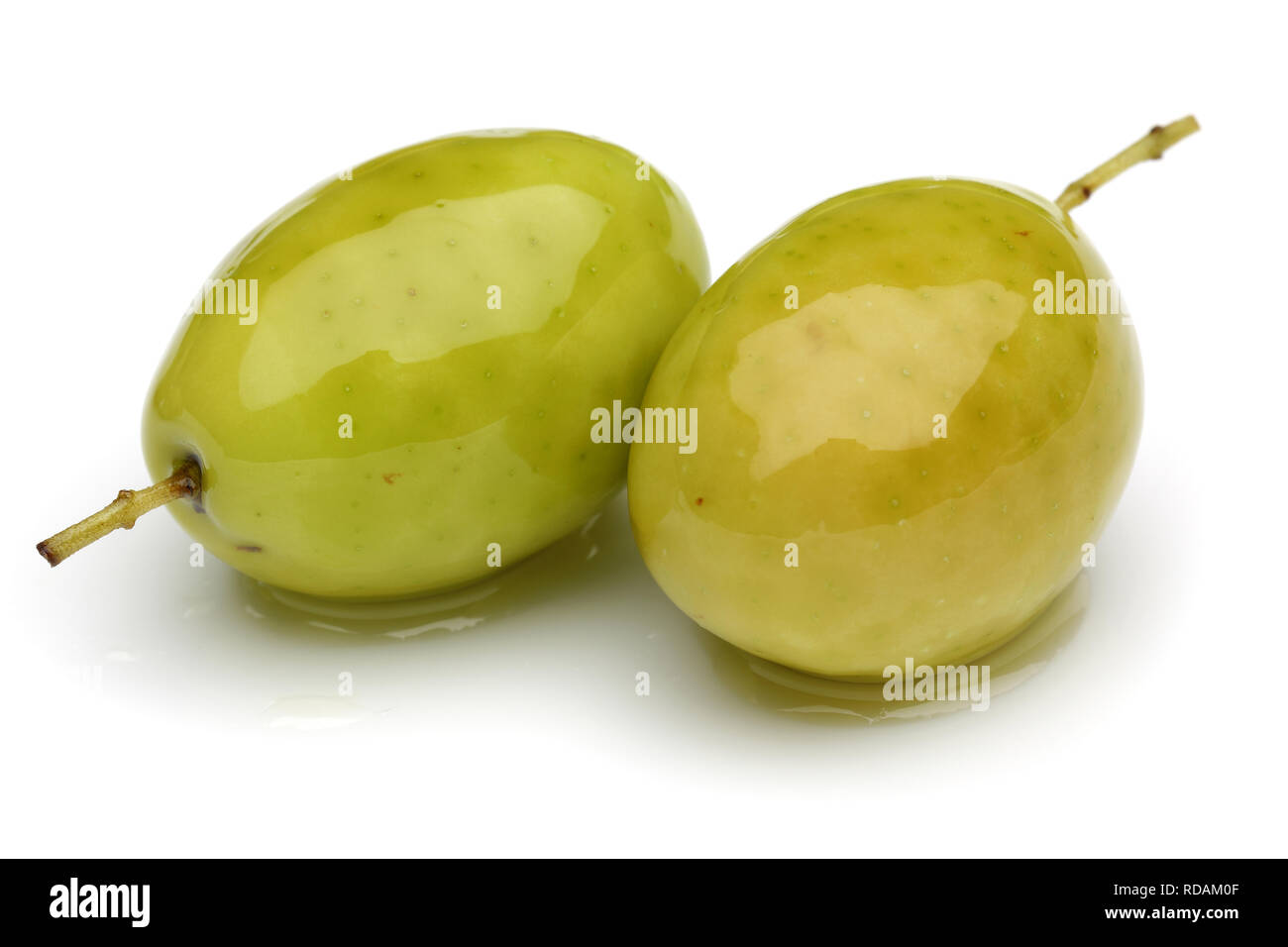 Green olives isolated on white background Stock Photo - Alamy