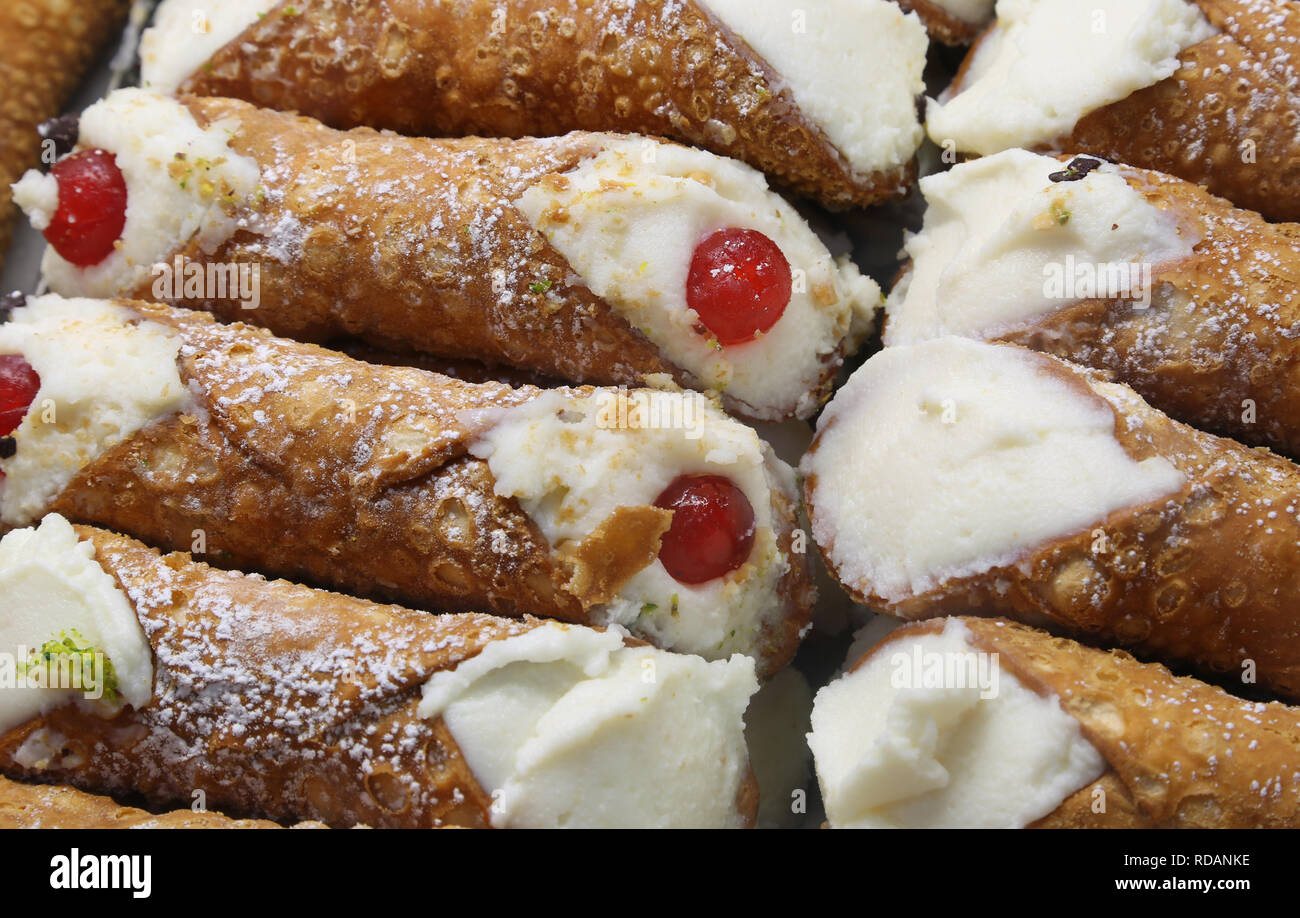 sweety pastry called CANNOLO SICILIANO in Italian Language for sale at sicilian pastry shop Stock Photo