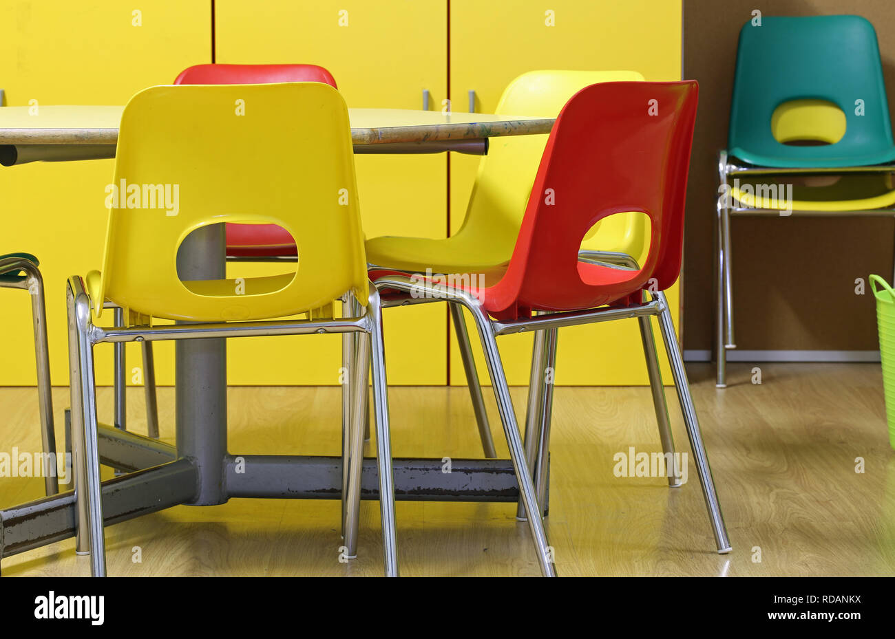 inside a classroom of a kindergarten with small chairs and a hexagonal