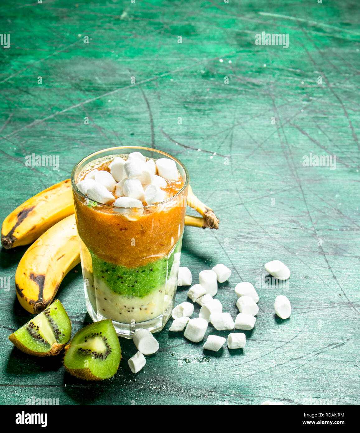 Fruit smoothie with marshmallows. On rustic background Stock Photo Alamy