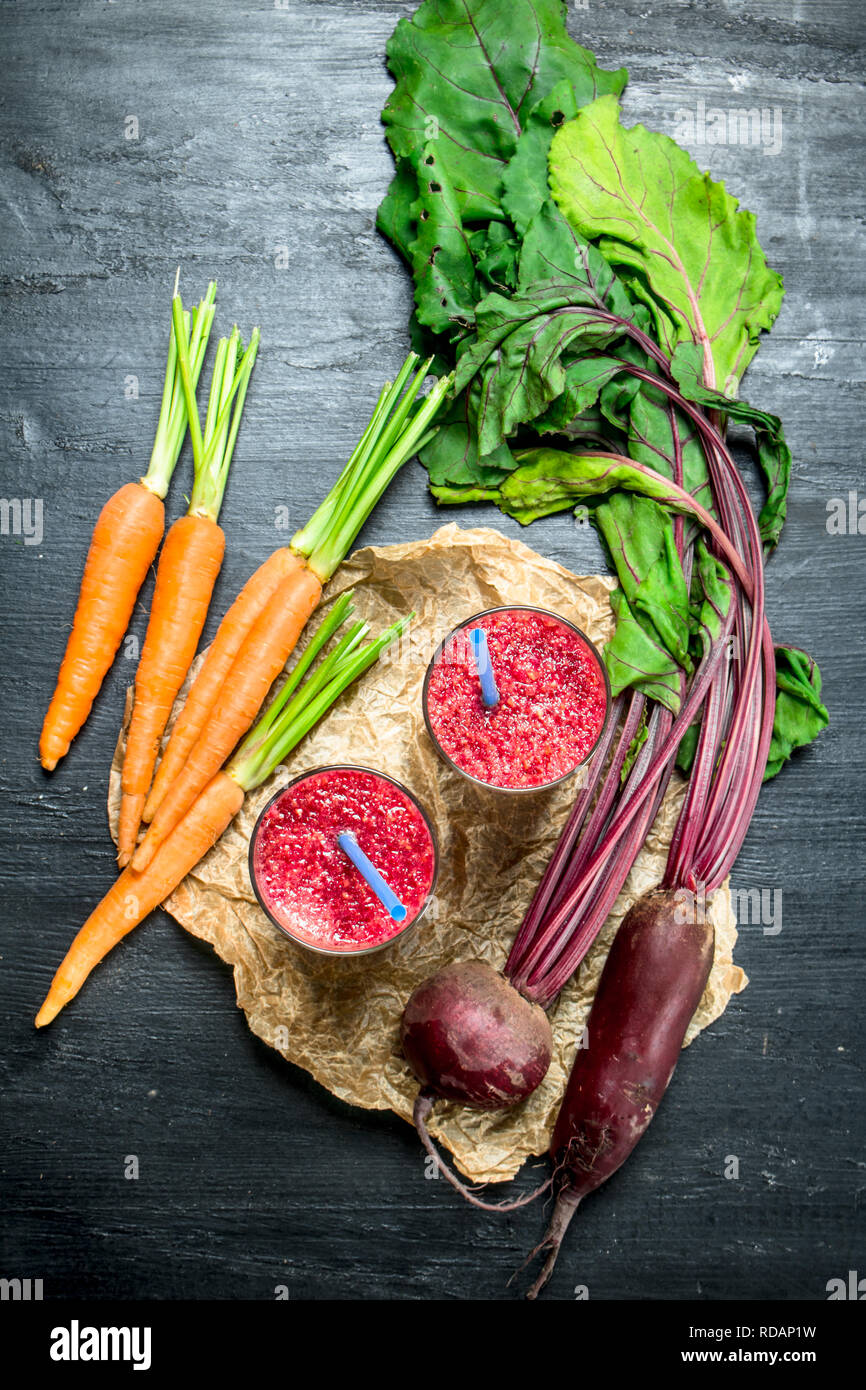 Vegetable smoothie with beets and carrots. On black background Stock