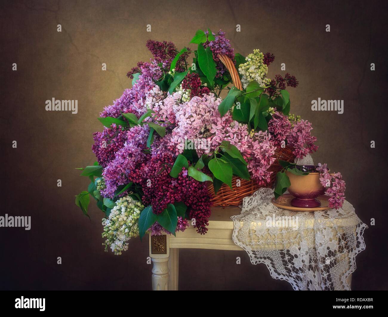Still life with bouquet of multicolored lilac Stock Photo - Alamy