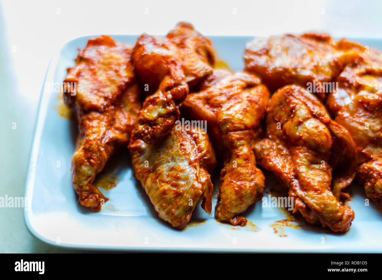 chicken wings marinated in a barbecue sauce, a typical American snack