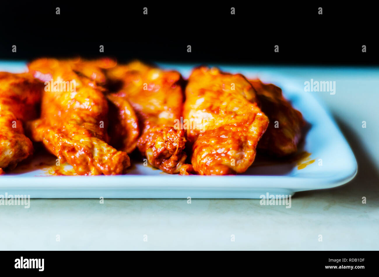 chicken wings marinated in a barbecue sauce, a typical American snack, delicious food Stock