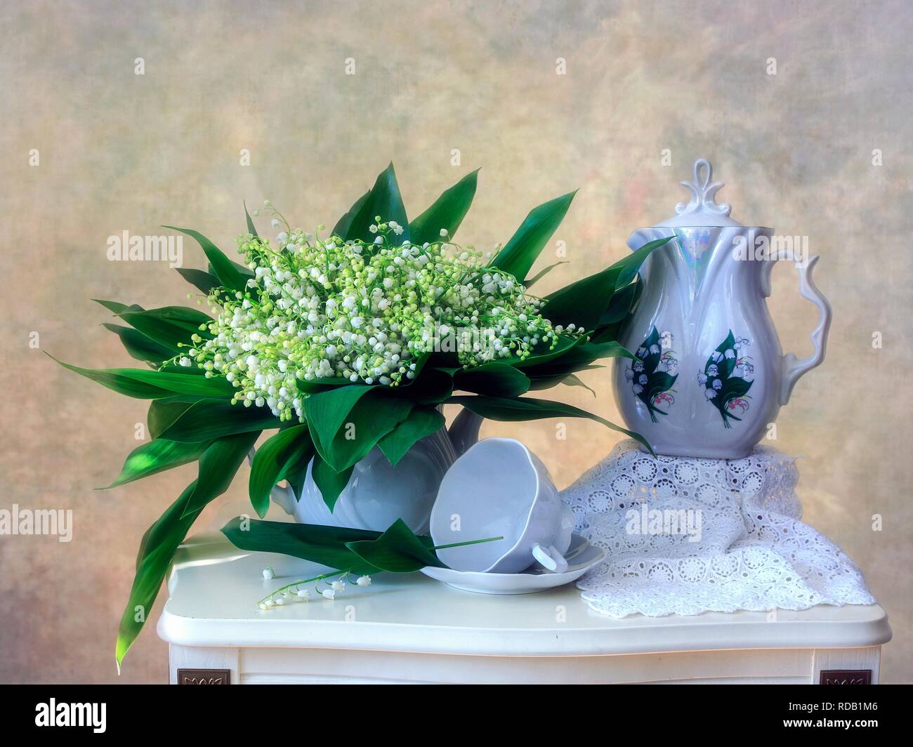 Still life with bouquet lily of the valley Stock Photo - Alamy