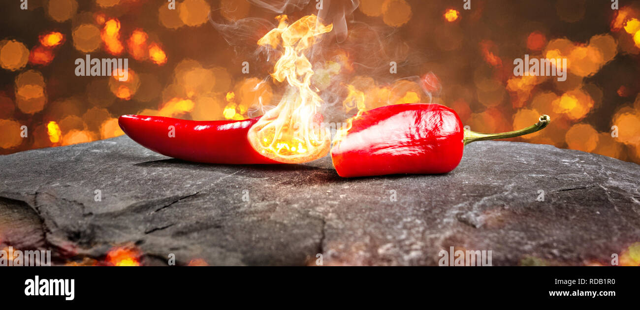 Burning hot chili pepper with a flame Stock Photo Alamy