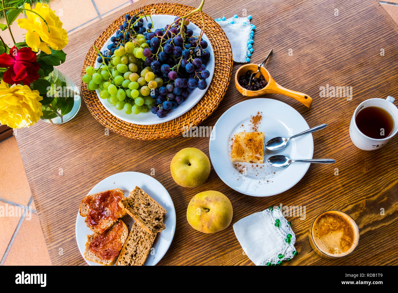 Breakfast with toast, cake and fruit Stock Photo Alamy