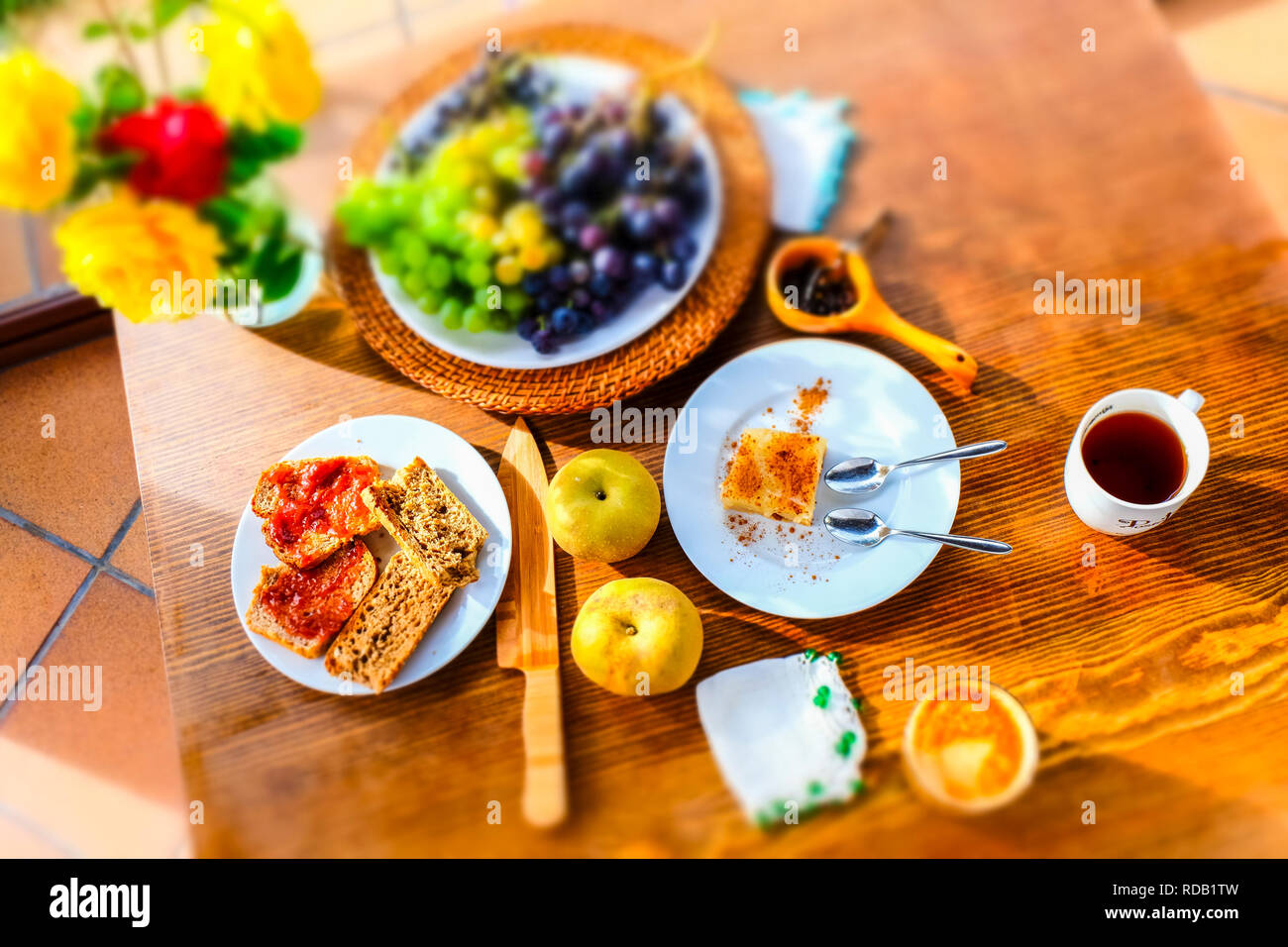 Breakfast with toast, cake and fruit Stock Photo Alamy