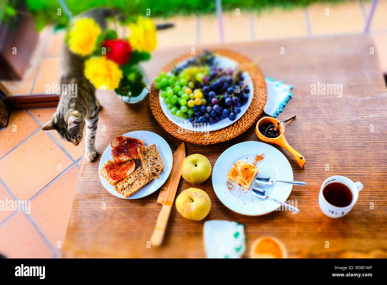 Breakfast with toast, cake and fruit Stock Photo Alamy