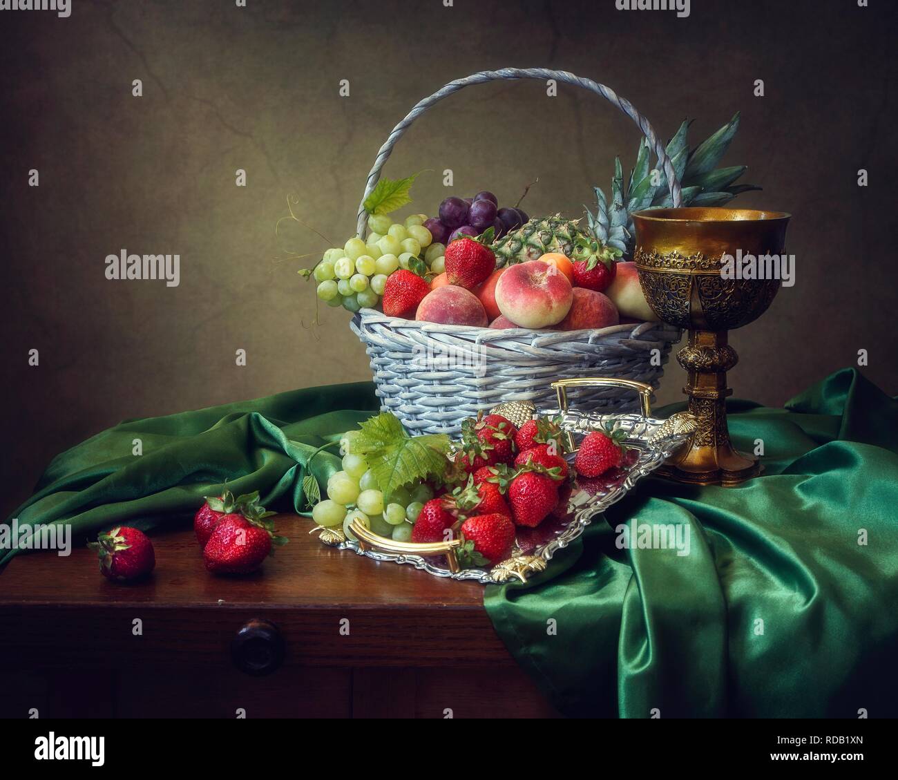 Still life with basket of fruits Stock Photo - Alamy