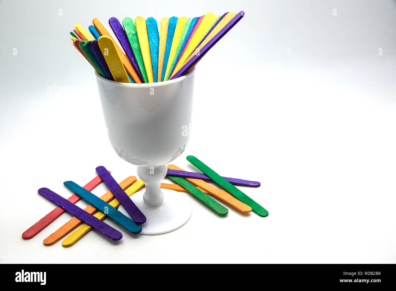 Colorful Scattered Wooden Multicolored Popsicle Sticks Stock Photo -  Download Image Now - iStock