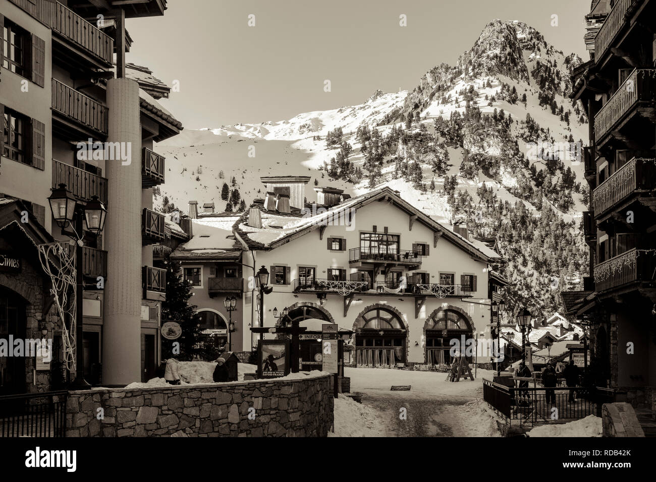On the street in the resort of Arc 1950 with the mountain behind. Stock Photo