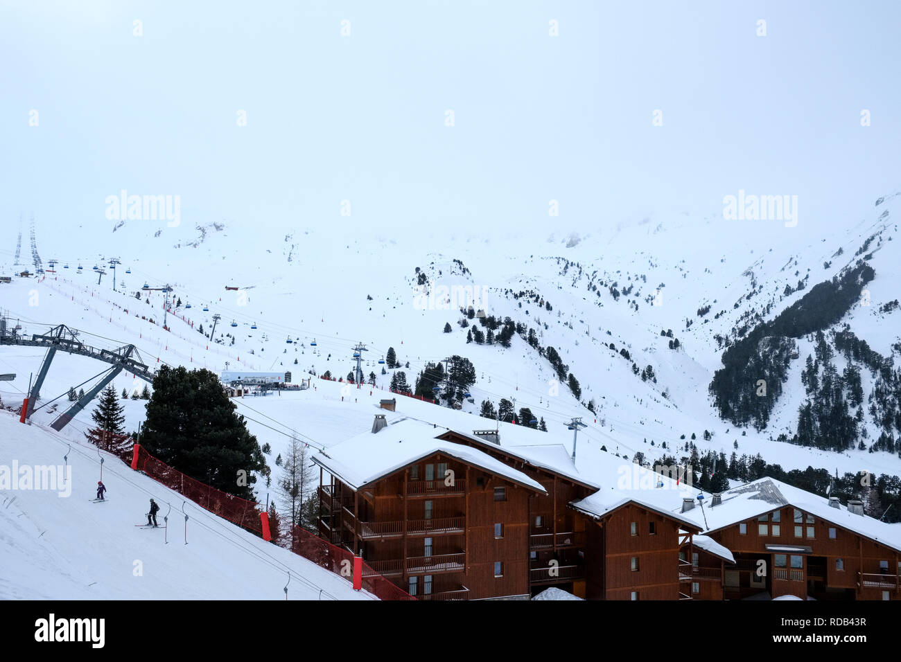 From the balcony: Wednesday snow. White-out over the piste at Arc 2000. Stock Photo