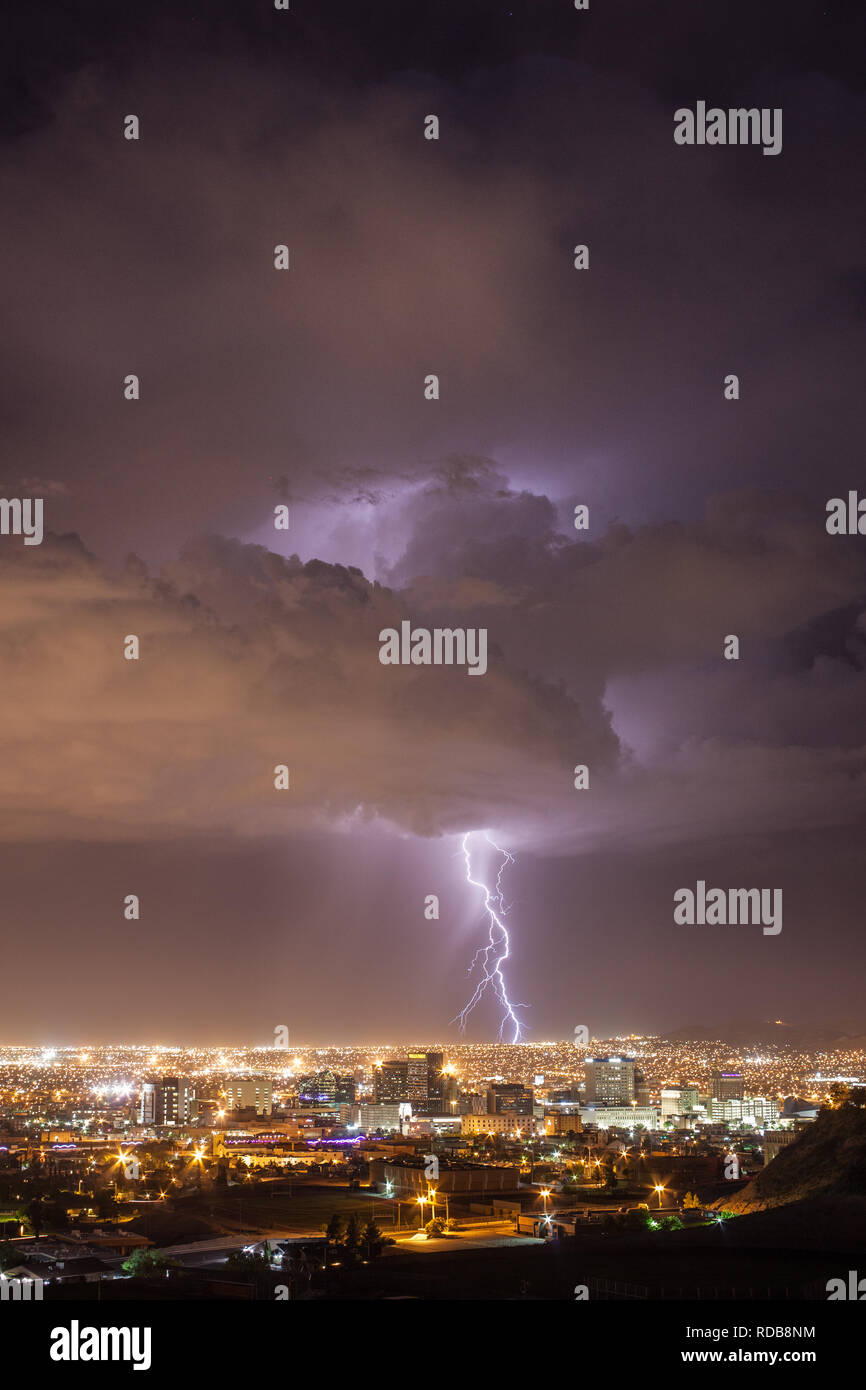Lightning strikes the urban landscape behind the downtown El Paso