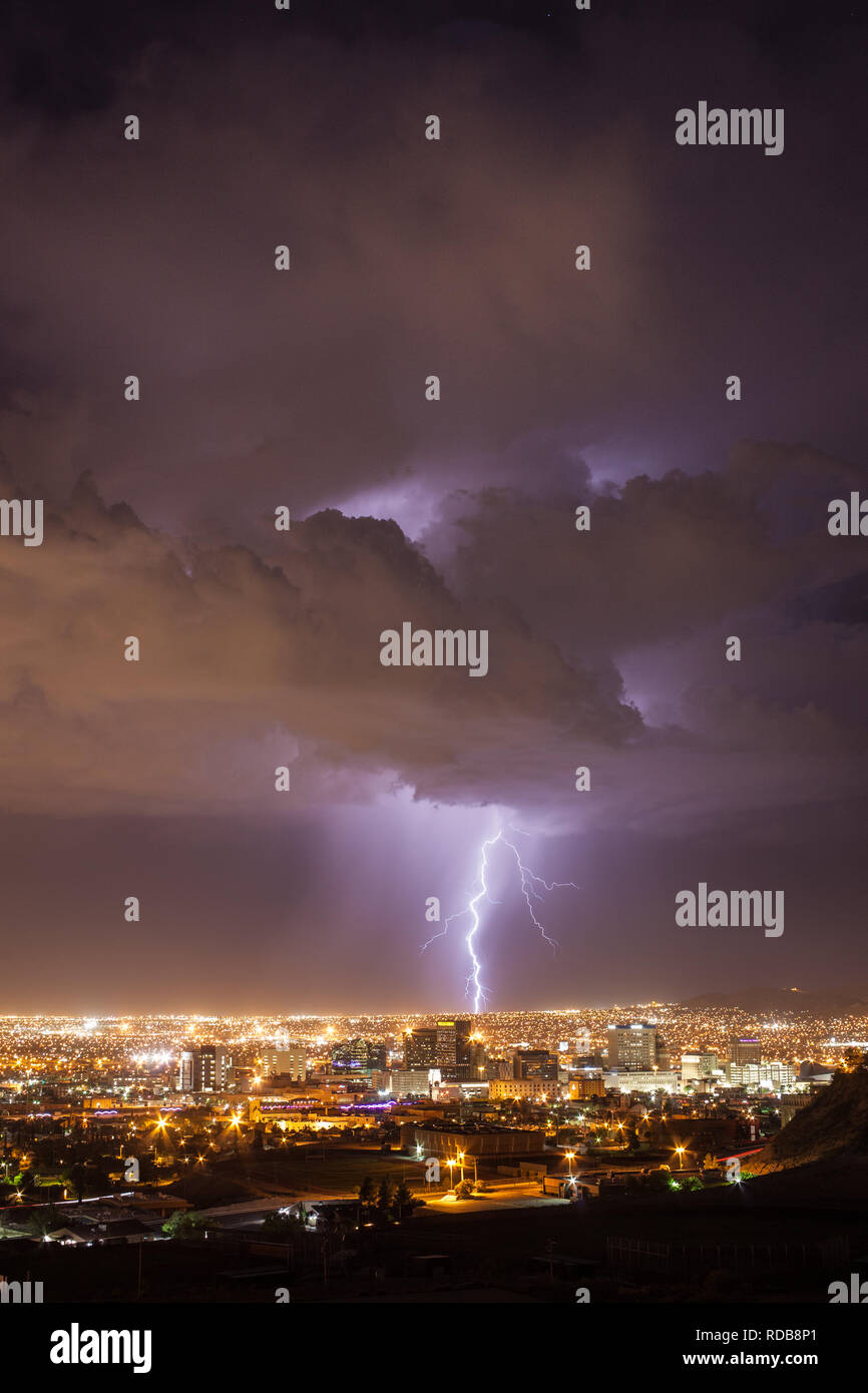 Lightning strikes the urban landscape behind the downtown El Paso