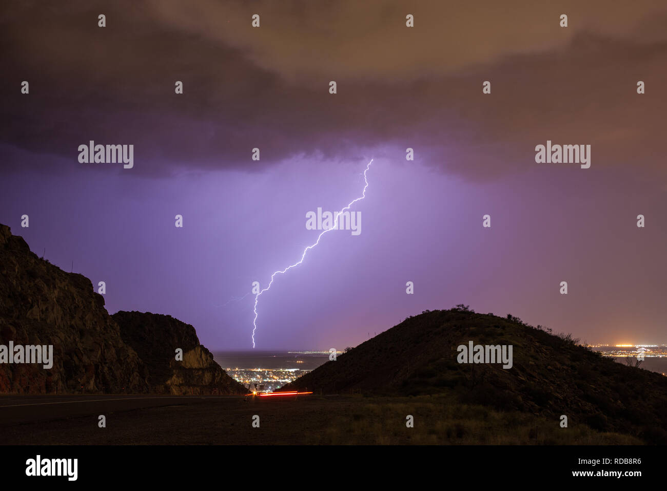 Lightning strikes northeast El Paso near Fort Bliss, as seen through a gap  in the Franklin Mountains on Transmountain Road Stock Photo - Alamy