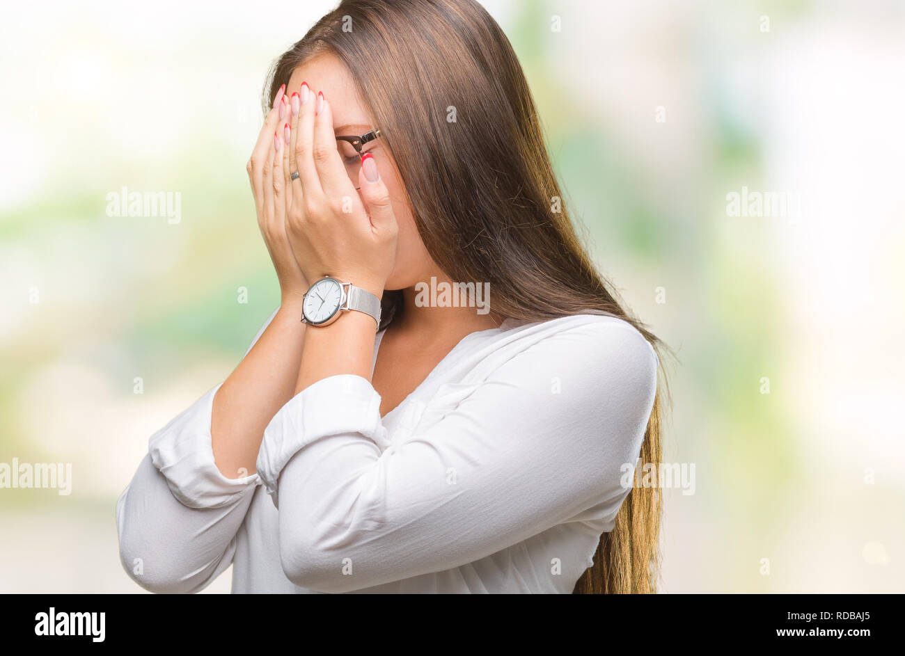 Young caucasian beautiful business woman wearing glasses over isolated background with sad expression covering face with hands while crying. Depressio Stock Photo