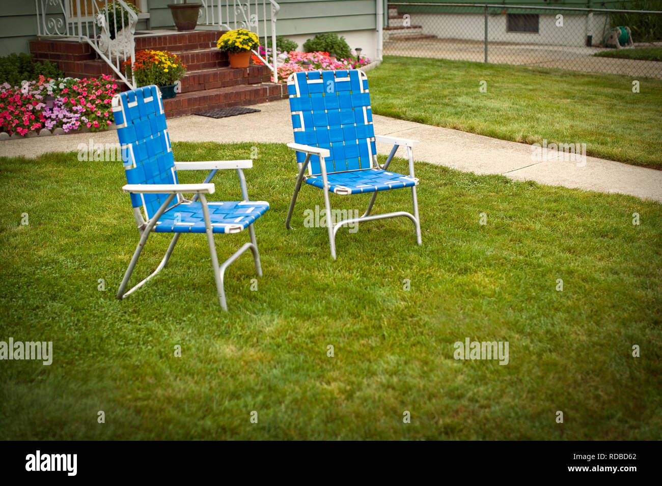 Deck chairs on a lawn Stock Photo - Alamy