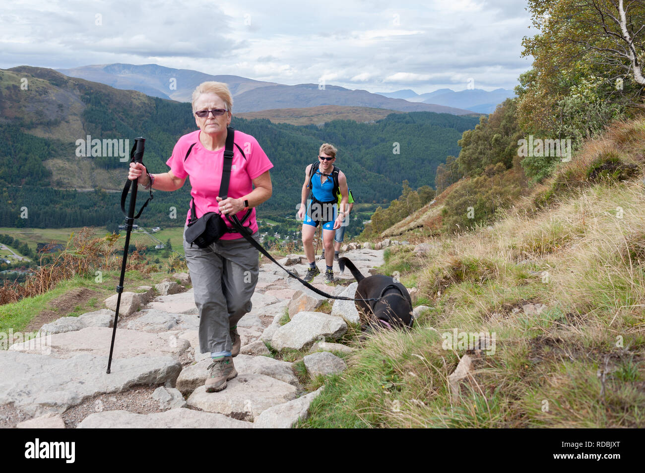 Walkers on the ben nevis path make there way up and down Stock Photo
