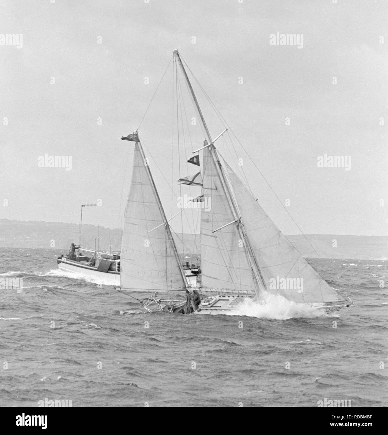 Lone non-stop round the world yachtsman, Robin Knox-Johnston in his 32ft ketch Suhaili, pictured in the rough seas off Falmouth. Stock Photo